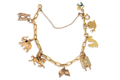 Lot 356 - AN 18CT GOLD BRACELET, suspending charms, 18ct...