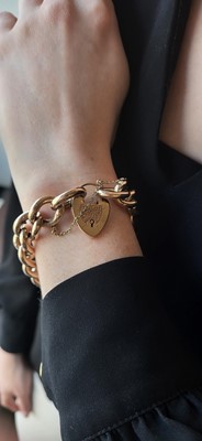 Lot 13 - AN ANTIQUE GOLD CURB BRACELET, with padlock...