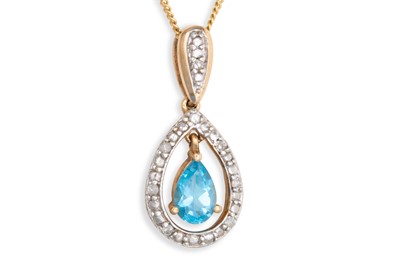 Lot 24 - A TOPAZ AND DIAMOND PENDANT, the pear shaped...