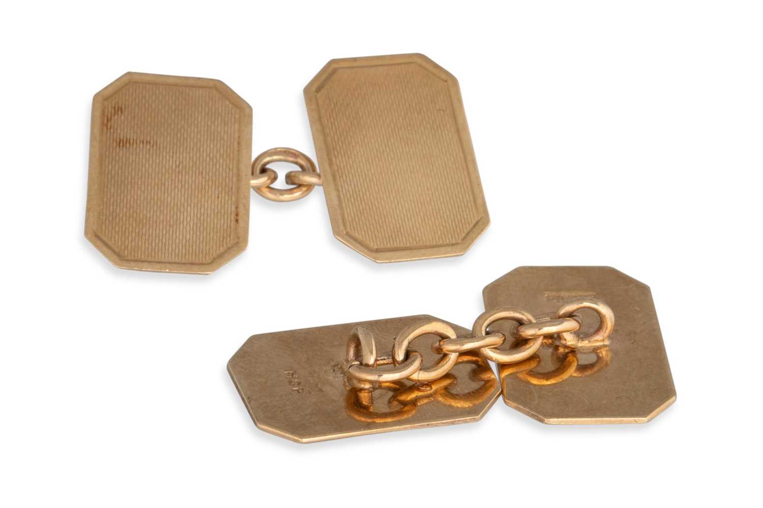 Lot 82 - A PAIR OF 9CT GOLD CUFF LINKS, engine turned...