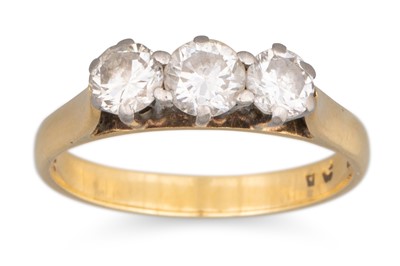 Lot 44 - A DIAMOND THREE STONE RING, the round...