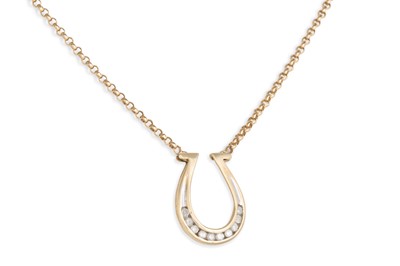 Lot 127 - A DIAMOND SET PENDANT, modelled as a horseshoe,...