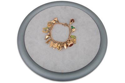 Lot 371 - A 9CT GOLD CURBLINK BRACELET, suspending some...