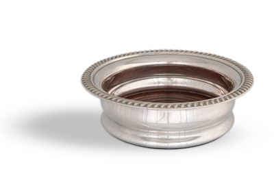 Lot 485 - A MODERN CIRCULAR SILVER WINE COASTER, the...