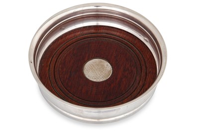 Lot 486 - A MODERN CIRCULAR SILVER WINE COASTER,...