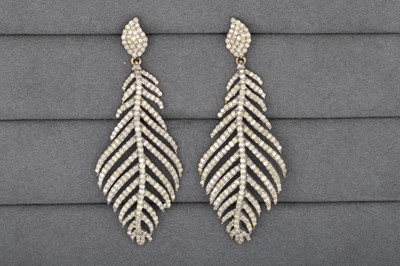 Lot 7 - A PAIR OF DIAMOND SET DROP EARRINGS, modelled...