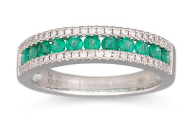 Lot 41 - A DIAMOND AND EMERALD THREE ROWED RING,...