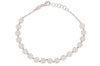 Lot 44 - A DIAMOND SET BRACELET, comprising circular...