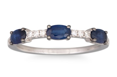 Lot 179 - A DIAMOND AND SAPPHIRE SET RING, the three...