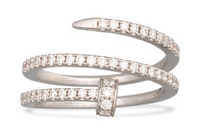 Lot 193 - A DIAMOND SET CROSS OVER RING, in the form of...