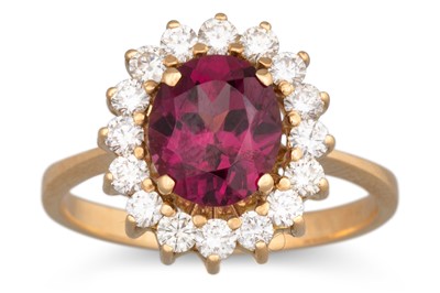 Lot 189 - A GARNET AND DIAMOND CLUSTER RING, mounted in...