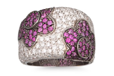 Lot 142 - A RUBY AND PAVÉ DIAMOND SET RING, floral...
