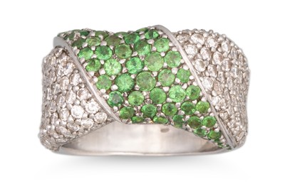 Lot 144 - A GREEN GARNET AND PAVÉ DIAMOND SET RING, wrap...