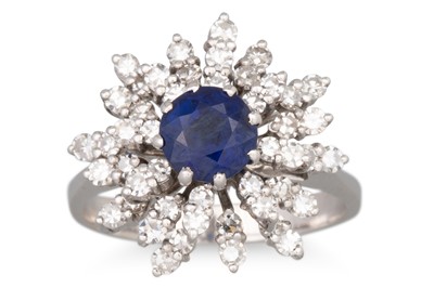 Lot 147 - A SAPPHIRE AND DIAMOND RING, cluster design,...