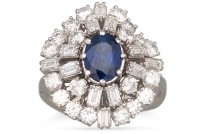 Lot 159 - A SAPPHIRE AND DIAMOND CLUSTER RING, the oval...