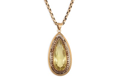 Lot 122 - A YELLOW METAL CHAIN, suspending a large stone...