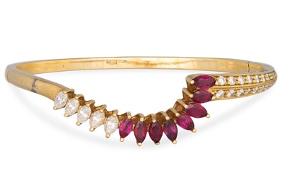 Lot 182 - A RUBY AND DIAMOND BRACELET, set with marquise...