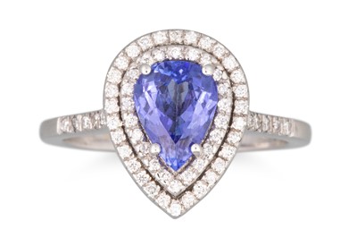 Lot 296 - A TANZANITE AND DIAMOND RING, the pear shaped...