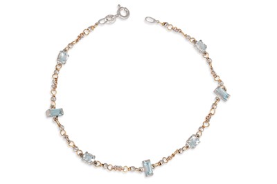 Lot 345 - AN AQUAMARINE BRACELET, the oval and baguette...