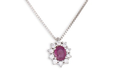 Lot 349 - A RUBY AND DIAMOND CLUSTER PENDANT, oval form...