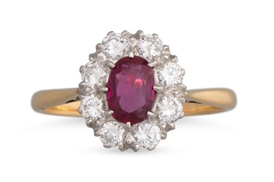 Lot 210 - A RUBY AND DIAMOND CLUSTER RING, the oval ruby...