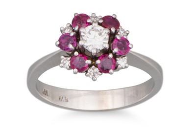 Lot 160 - A RUBY AND DIAMOND CLUSTER RING, set with...