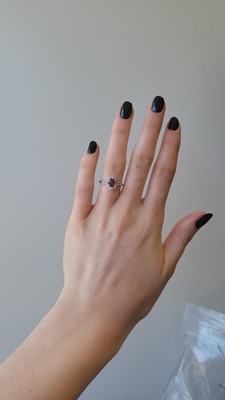 Lot 51 - A DIAMOND AND RUBY CLUSTER RING, oval ruby to...