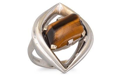 Lot 51 - A 1970's TIGER'S EYE SET DRESS RING, the stone...