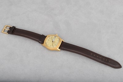 Lot 172 - A 'TIMEX' WRISTWATCH, gold tone dial with date,...