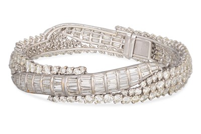 Lot 223 - A DIAMOND HINGED BRACELET, set with brilliant...