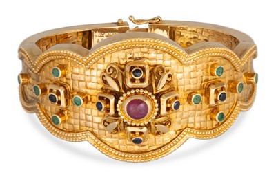 Lot 210 - A LALOUNIS 18CT GOLD BANGLE, of shaped form,...