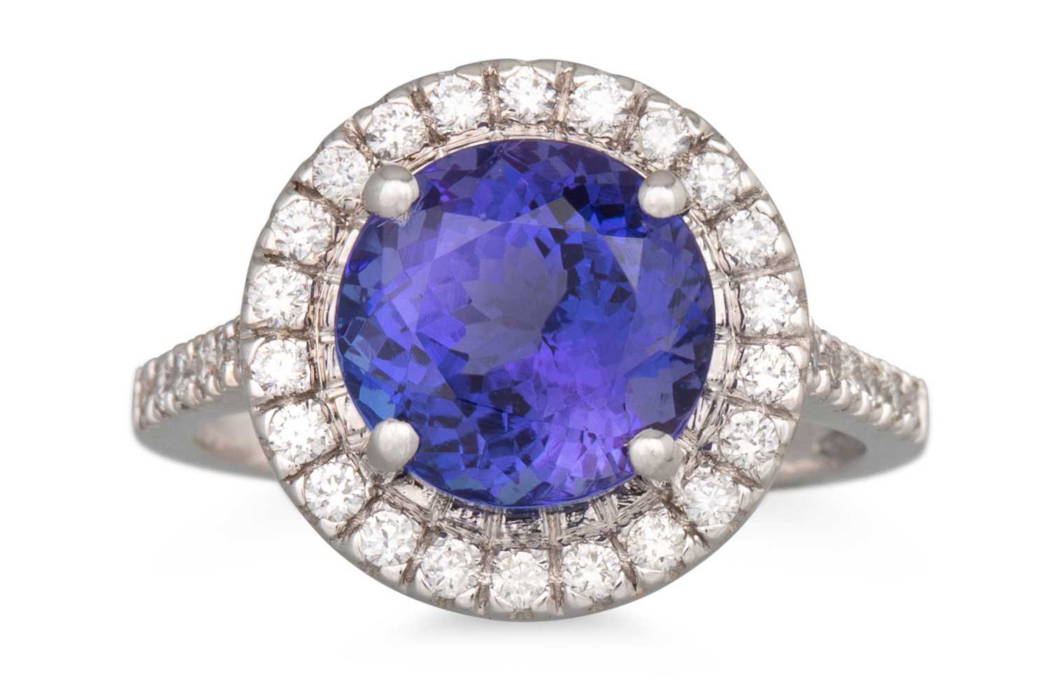 Lot 71 - A TANZANITE AND DIAMOND CLUSTER RING, the...