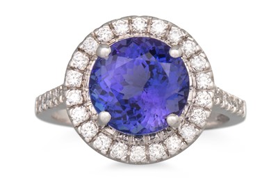Lot 71 - A TANZANITE AND DIAMOND CLUSTER RING, the...