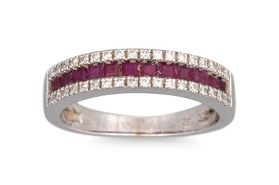 Lot 236 - A RUBY AND DIAMOND BAND RING, the channel set...