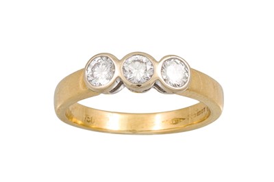 Lot 201 - A THREE STONE DIAMOND RING, the brilliant cut...