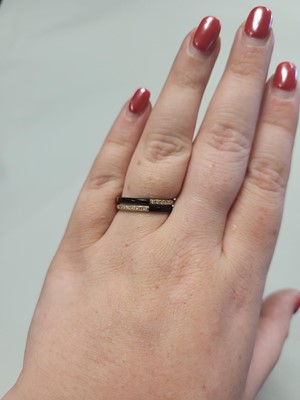 Lot 66 - A TWO ROWED ONYX AND DIAMOND RING, mounted in...