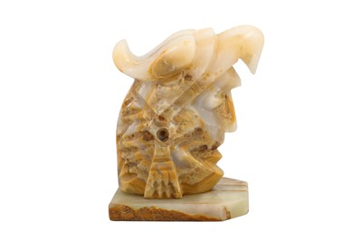 Lot 445 - A BANDED AGATE SCULPTURE OF A HELMETED WARRIOR,...