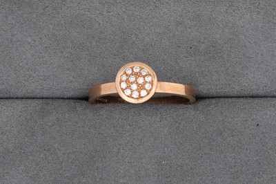 Lot 81 - A PAVÉ SET DIAMOND CLUSTER RING, mounted in...