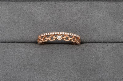 Lot 82 - A DIAMOND TWO-ROWED RING, in 10ct rose gold,...