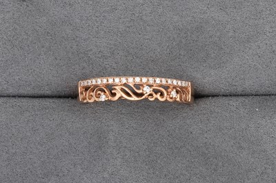 Lot 83 - A DIAMOND TWO-ROWED RING, in 10ct rose gold,...