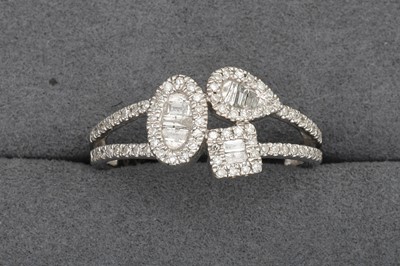 Lot 111 - A DIAMOND TRIPLE CLUSTER RING, to split...