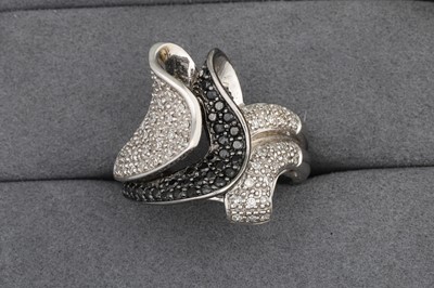 Lot 97 - A DIAMOND CLUSTER RING, pavé set in 14ct white...