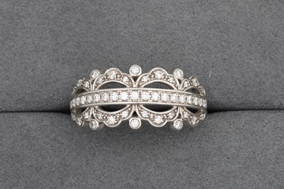 Lot 119 - A THREE ROWED DIAMOND SET BAND RING, mounted...