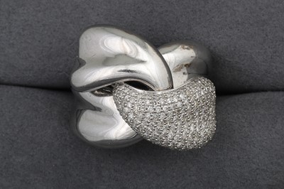 Lot 105 - AN UNUSUAL DIAMOND SET WRAP OVER RING, pavé...
