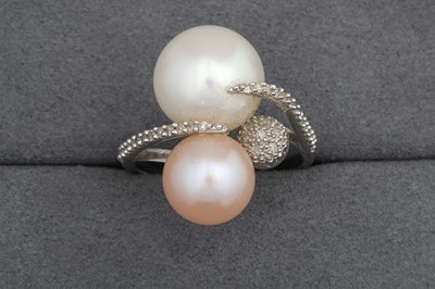 Lot 124 - A PEARL AND DIAMOND RING, the white and pink...