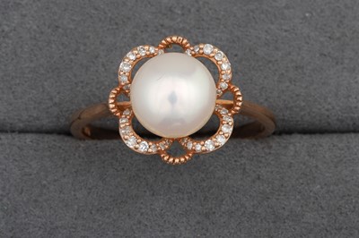 Lot 113 - A PEARL AND DIAMOND CLUSTER RING, mounted in...