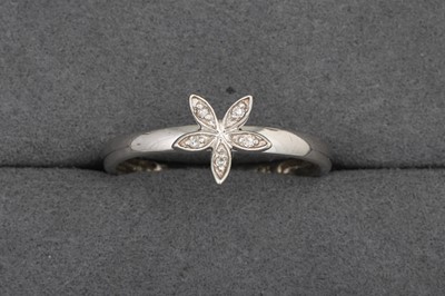 Lot 137 - A DIAMOND CLUSTER RING, mounted in 9ct white...