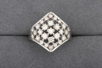 Lot 138 - A DIAMOND PLAQUE CLUSTER RING, of open-work...
