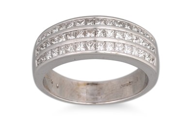 Lot 308 - A TRIPLE ROWED DIAMOND SET RING, the princess...