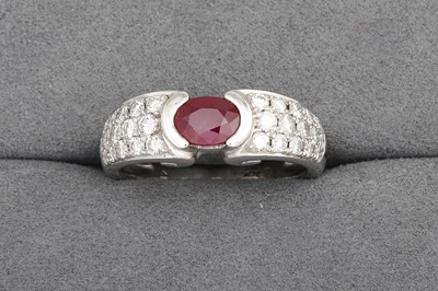 Lot 8 - A RUBY AND DIAMOND RING, the oval ruby to pavé...